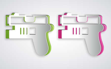 Paper cut Futuristic space gun blaster icon isolated on grey background. Laser Handgun. Alien Weapon. Paper art style. Vectorのイラスト素材