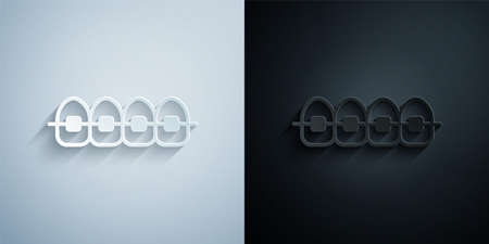 Paper cut Teeth with braces icon isolated on grey and black background. Alignment of bite of teeth, dental row with with braces. Dental concept. Paper art style. Vectorのイラスト素材