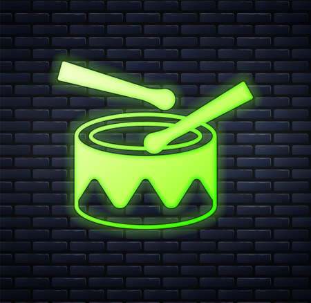 Glowing neon Drum with drum sticks icon isolated on brick wall background. Music sign. Musical instrument symbol. Vectorのイラスト素材
