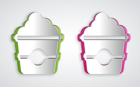 Paper cut Popcorn in cardboard box icon isolated on grey background. Popcorn bucket box. Paper art style. Vectorのイラスト素材