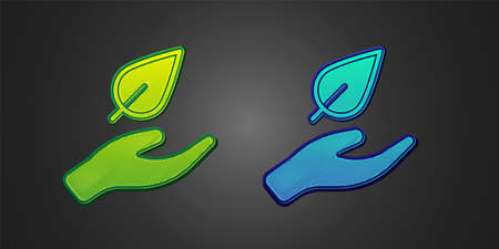Green and blue Hand hold a leaf of the plant icon isolated on black background. Care nature. Leaf shoots with environmental protection. Vectorのイラスト素材