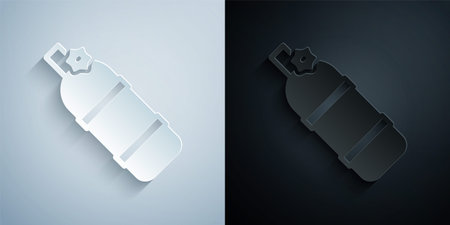 Paper cut Aqualung icon isolated on grey and black background. Oxygen tank for diver. Diving equipment. Extreme sport. Diving underwater equipment. Paper art style. Vectorのイラスト素材