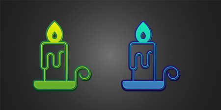 Green and blue Burning candle in candlestick icon isolated on black background. Cylindrical candle stick with burning flame. Vectorのイラスト素材