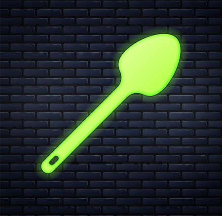 Glowing neon Teaspoon icon isolated on brick wall background. Cooking utensil. Cutlery sign. Vectorのイラスト素材