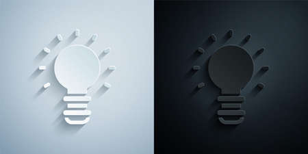Paper cut Creative lamp light idea icon isolated on grey and black background. Concept ideas inspiration, invention, effective thinking, knowledge and education. Paper art style. Vectorのイラスト素材