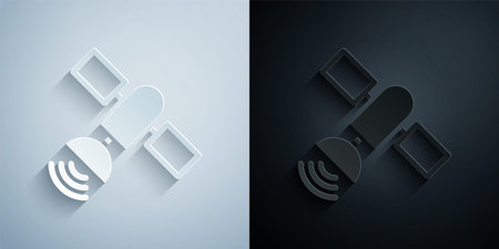 Paper cut Satellite icon isolated on grey and black background. Paper art style. Vectorのイラスト素材