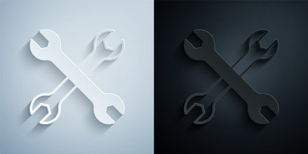 Paper cut Wrench spanner icon isolated on grey and black background. Spanner repair tool. Service tool symbol. Paper art style. Vectorのイラスト素材