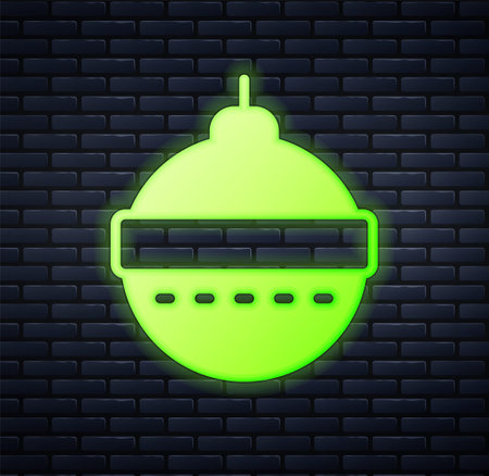 Glowing neon Christmas ball icon isolated on brick wall background. Merry Christmas and Happy New Year. Vectorのイラスト素材