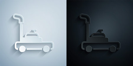 Paper cut Lawn mower icon isolated on grey and black background. Lawn mower cutting grass. Paper art style. Vectorのイラスト素材