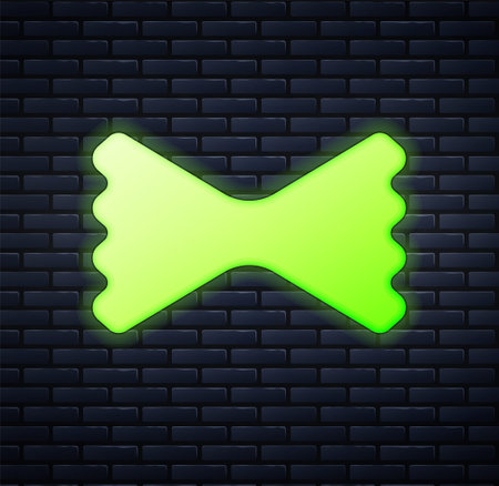 Glowing neon Macaroni icon isolated on brick wall background. Italian cuisine. Vectorのイラスト素材