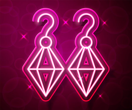 Glowing neon line Earrings icon isolated on red background. Jewelry accessories. Vectorのイラスト素材
