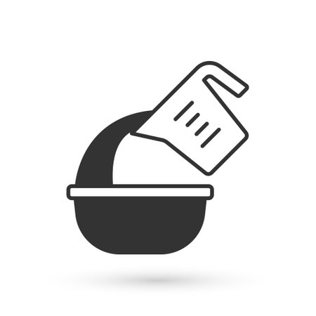 Grey Measuring cup pouring liquid into bowl icon isolated on white background. Plastic graduated beaker with handle. Vectorのイラスト素材