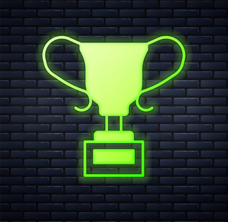 Glowing neon Award cup icon isolated on brick wall background. Winner trophy symbol. Championship or competition trophy. Sports achievement sign. Vectorのイラスト素材