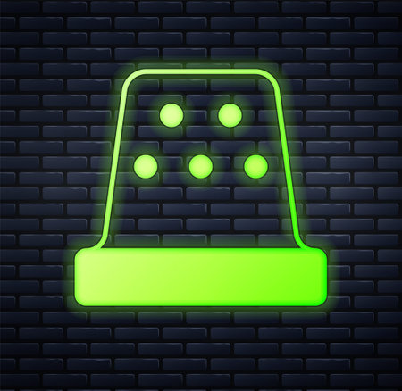 Glowing neon Thimble for sewing icon isolated on brick wall background. Vectorのイラスト素材