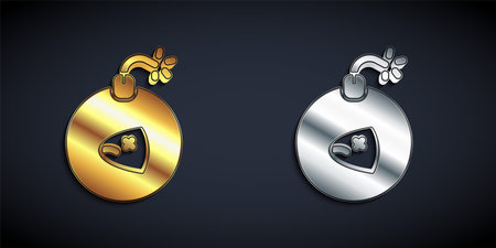 Gold and silver Bomb ready to explode icon isolated on black background. Long shadow style. Vectorのイラスト素材