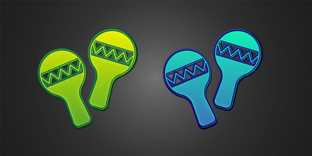 Green and blue Maracas icon isolated on black background. Music maracas instrument mexico. Vectorのイラスト素材