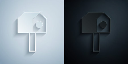 Paper cut Bird house icon isolated on grey and black background. Nesting box birdhouse, homemade building for birds. Paper art style. Vectorのイラスト素材