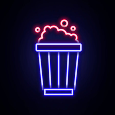 Glowing neon line Popcorn in cardboard box icon isolated on brick wall background. Popcorn bucket box. Colorful outline concept. Vectorのイラスト素材