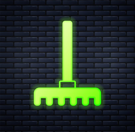 Glowing neon Garden rake icon isolated on brick wall background. Tool for horticulture, agriculture, farming. Ground cultivator. Housekeeping equipment. Vectorのイラスト素材