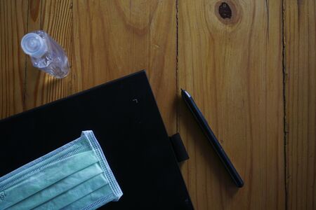 Hand sanitizer alcohol bottle on the table in office, Health care and COVID-19 Coronavirus concept. Work from Homeの写真素材