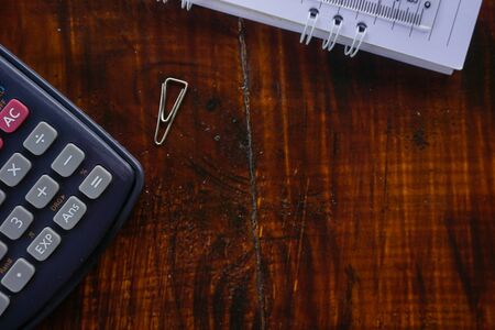 accountant office workspace with notebook, pen and calculatorの写真素材
