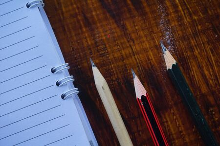 School supplies on wooden background with copy space.