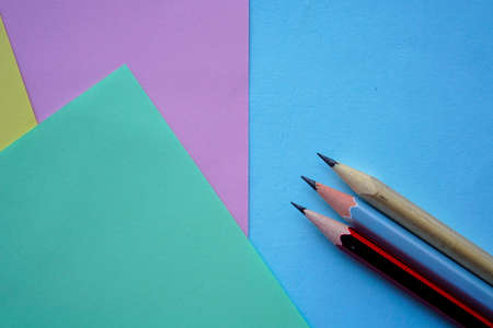 Pastel Color paper and pencil for background. minimalist back to school copy space concept for text.の写真素材