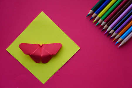 Arrange of pencils color and some origami paper with paper color background. Back to school conceptの写真素材