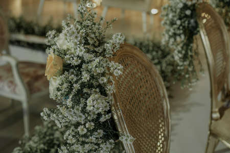 flower bouquet on wedding chair. golden concept weddingの写真素材