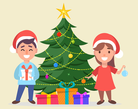 Merry Christmas and a Happy New Year greeting card. Boy and girl in Santa Claus hats standing near decorated Christmas tree with gift boxes under it. Vector illustration.のイラスト素材