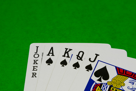 JAKARTA, INDONESIA - AUGUST 14, 2017 : Combination of black aces, king, queen, jack and joker on green background.のeditorial素材