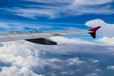 JAKARTA, INDONESIA - SEPTEMBER 26, 2017 : Air Asia airlines, airbus A320-200 PK-AZI wing flying over the cloud. shoot from airplane window in summer seasonのeditorial素材