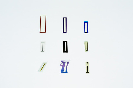 Set of collection colorful newspaper cut out letters as ornaments or design elements. Isolated on white background. Letter I.の写真素材