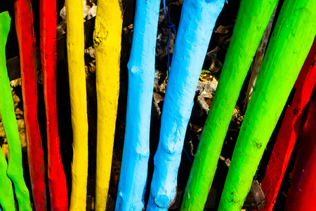 Closeup view of colourful bamboo fences. background texture and pattern.の写真素材