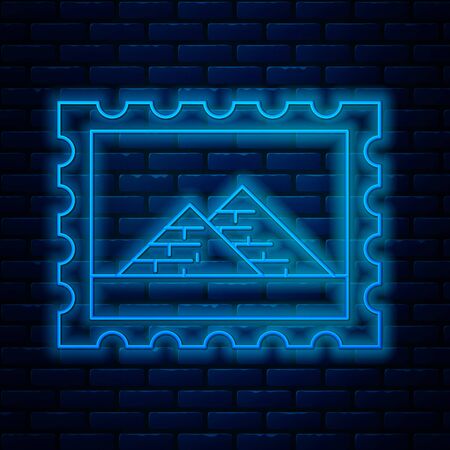 Glowing neon line Postal stamp and Egypt pyramids icon isolated on brick wall background. Vector Illustrationのイラスト素材
