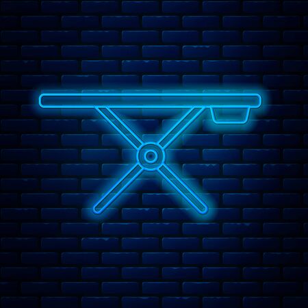 Glowing neon line Ironing board icon isolated on brick wall background. Vector Illustrationのイラスト素材