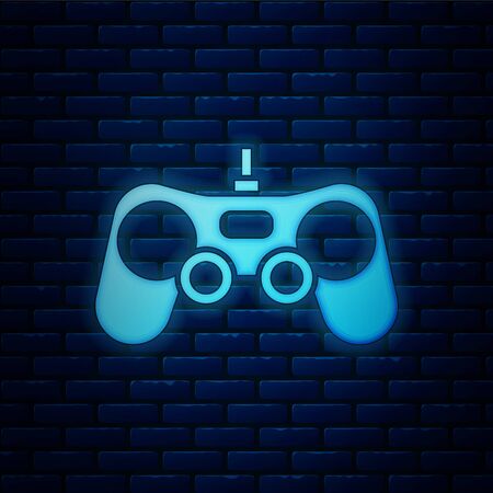 Glowing neon Gamepad icon isolated on brick wall background. Game controller. Vector Illustrationのイラスト素材