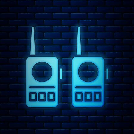 Glowing neon Walkie talkie icon isolated on brick wall background. Portable radio transmitter icon. Radio transceiver sign. Vector Illustrationのイラスト素材