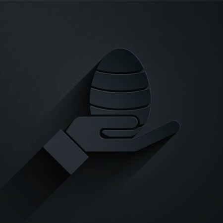 Paper cut Human hand and easter egg icon isolated on black background. Happy Easter. Paper art style. Vector Illustrationのイラスト素材