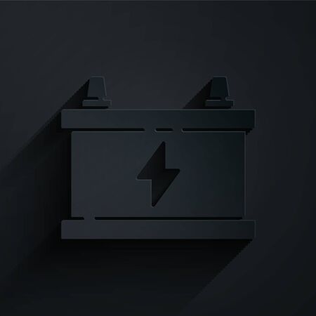 Paper cut Car battery icon isolated on black background. Accumulator battery energy power and electricity accumulator battery. Paper art style. Vector Illustrationのイラスト素材