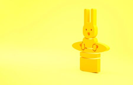 Yellow Magician hat and rabbit icon isolated on yellow background. Magic trick. Mystery entertainment concept. Minimalism concept. 3d illustration 3D render.の写真素材