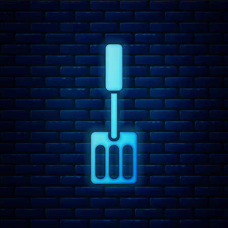 Glowing neon Spatula icon isolated on brick wall background. Kitchen spatula icon. BBQ spatula sign. Barbecue and grill tool. Vectorのイラスト素材