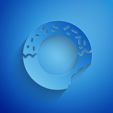 Paper cut Donut with sweet glaze icon isolated on blue background. Paper art style. Vectorのイラスト素材