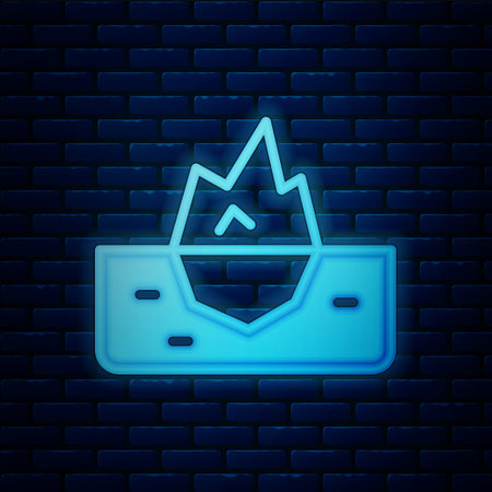 Glowing neon Iceberg icon isolated on brick wall background. Vectorのイラスト素材