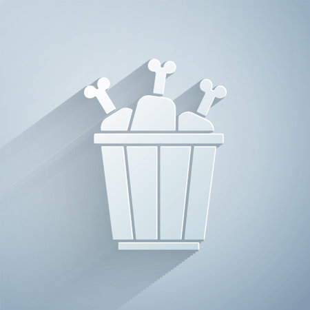 Paper cut Chicken leg in package box icon isolated on grey background. Chicken drumstick. Paper art style. Vectorのイラスト素材