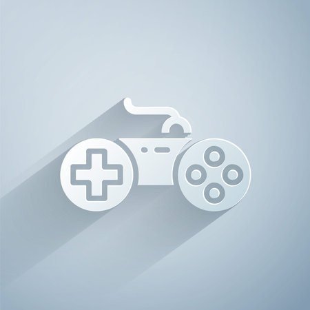 Paper cut Gamepad icon isolated on grey background. Game controller. Paper art style. Vectorのイラスト素材