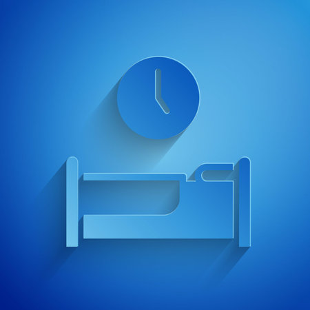 Paper cut Time to sleep icon isolated on blue background. Paper art style. Vector