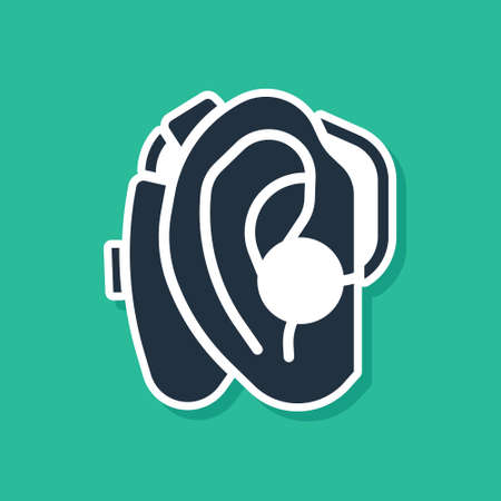 Blue Hearing aid icon isolated on green background. Hearing and ear. Vectorのイラスト素材