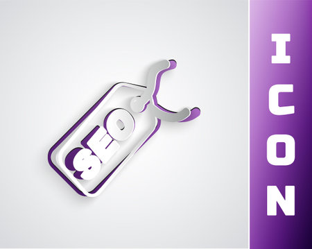 Paper cut SEO optimization icon isolated on grey background. Paper art style. Vectorのイラスト素材