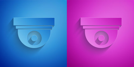 Paper cut Security camera icon isolated on blue and purple background. Paper art style. Vector